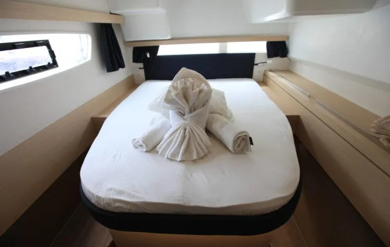 La Mer Kat Yacht Photos Pics Cabin interior of 2016 Fountaine Pajot Lucia 40 with neatly arranged bed linens.