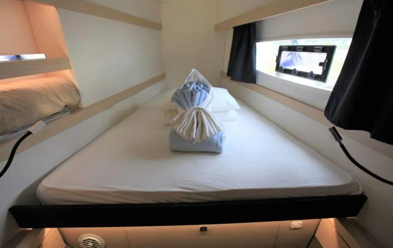 La Mer Kat Yacht Photos Pics Cabin interior of 2016 Fountaine Pajot Lucia 40 with neatly arranged bed linens.