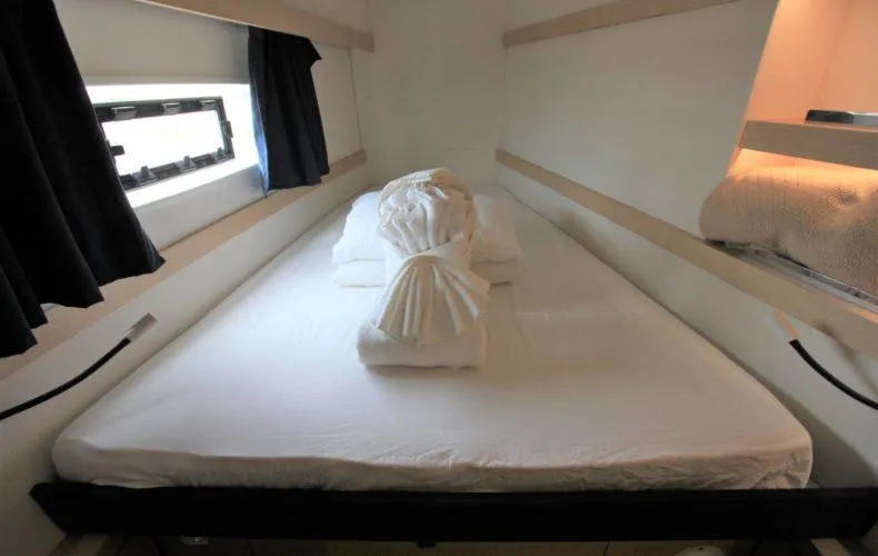 La Mer Kat Yacht Photos Pics Cabin interior of 2016 Fountaine Pajot Lucia 40 with neatly arranged bed linens.