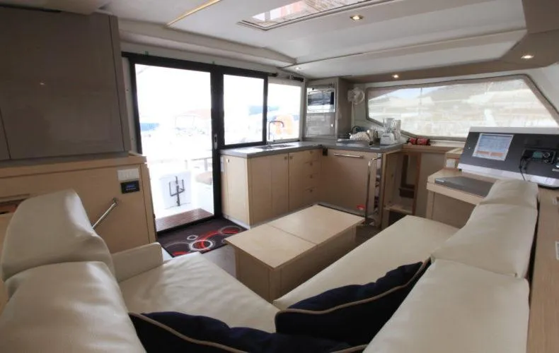 La Mer Kat Yacht Photos Pics Luxurious interior of 2016 Fountaine Pajot Lucia 40 catamaran with modern furnishings and spacious layout.