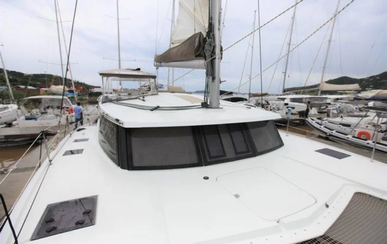La Mer Kat Yacht Photos Pics 2016 Fountaine Pajot Lucia 40 catamaran docked in a marina.