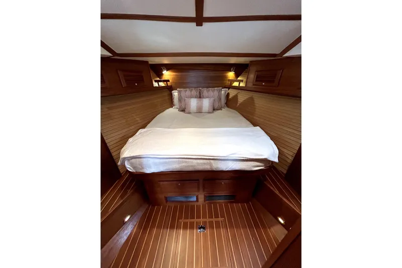  Yacht Photos Pics Cozy cabin interior of 2006 Sabre 38 Hard Top Express yacht with wooden finish.