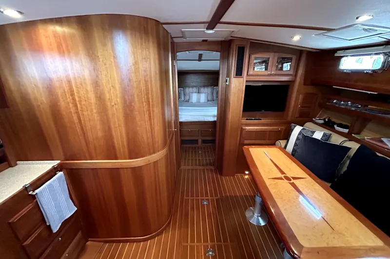  Yacht Photos Pics Luxurious interior of 2006 Sabre 38 Hard Top Express yacht with wood finishes and cozy seating.