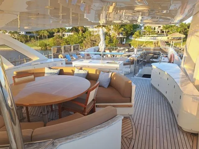  Yacht Photos Pics Luxurious 2009 Astondoa 95 GLX yacht deck with elegant seating and scenic views.