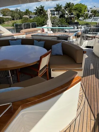  Yacht Photos Pics 2009 Astondoa 96 GLX yacht deck with seating area and table.