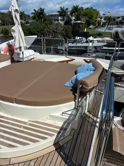  Yacht Photos Pics 2009 Astondoa 96 GLX yacht deck with sunbed and blue cushion.
