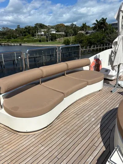  Yacht Photos Pics Astondoa 96 GLX 2009 yacht deck with beige seating, wooden flooring, and waterfront view.