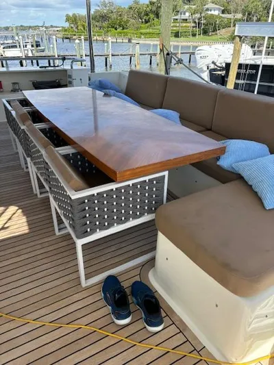  Yacht Photos Pics Astondoa 96 GLX 2009 yacht deck with seating, table, and shoes.
