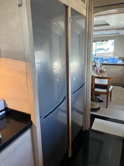  Yacht Photos Pics Modern kitchen interior on a 2009 Astondoa 96 GLX yacht, featuring sleek appliances.