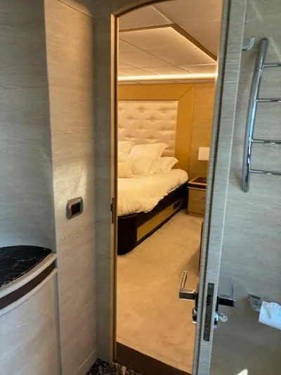  Yacht Photos Pics Luxury bedroom interior on 2009 Astondoa 96 GLX yacht, featuring elegant design and plush bedding.