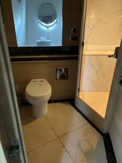  Yacht Photos Pics Bathroom interior of 2009 Astondoa 96 GLX yacht, featuring modern fixtures and marble accents.