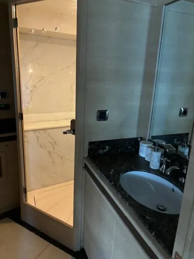  Yacht Photos Pics Luxurious bathroom in 2009 Astondoa 96 GLX yacht with marble shower and sleek sink.