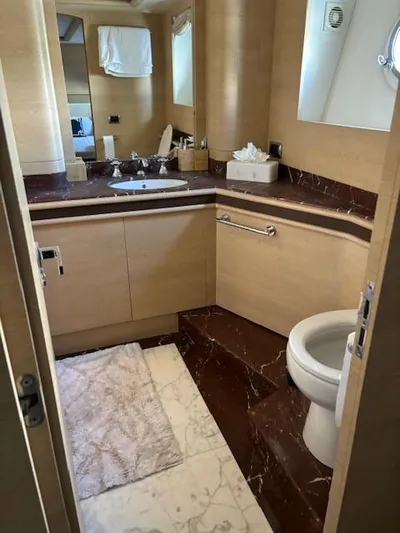  Yacht Photos Pics Luxurious bathroom on 2009 Astondoa 96 GLX yacht with marble accents and modern fixtures.
