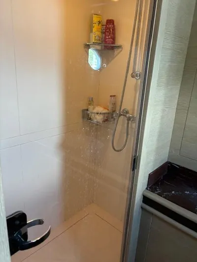  Yacht Photos Pics Shower area in 2009 Astondoa 96 GLX yacht, featuring modern fixtures and storage shelves.