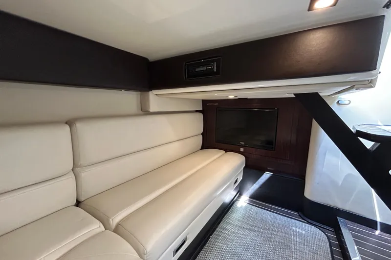  Yacht Photos Pics Interior of 2017 Monterey 355 Sport Yacht with beige seating and a wall-mounted TV.
