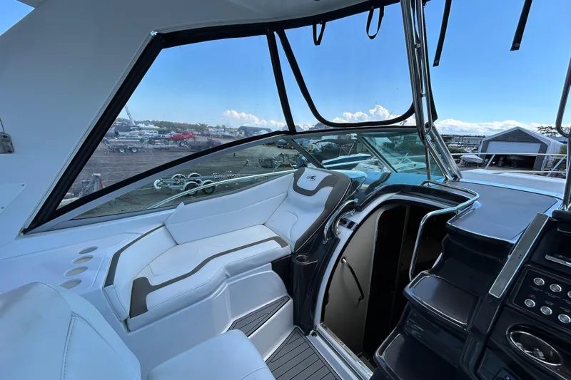  Yacht Photos Pics 2017 Monterey 355 Sport Yacht interior with white seating and modern dashboard.
