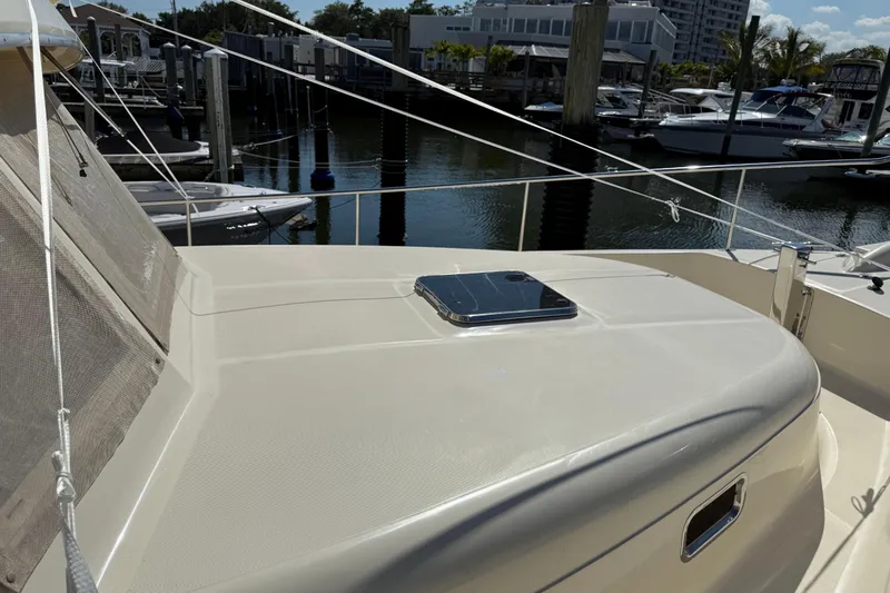  Yacht Photos Pics 2006 Mainship 34 Trawler deck view at marina with surrounding boats.
