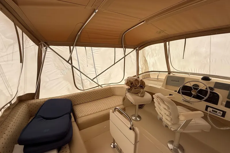  Yacht Photos Pics Interior of 2006 Mainship 34 Trawler with helm, seating, and navigation equipment.