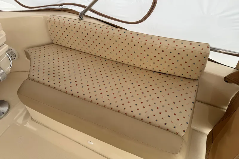  Yacht Photos Pics 2006 Mainship 34 Trawler interior seating with patterned upholstery and beige accents.