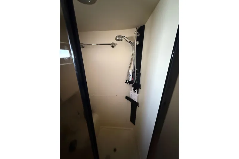  Yacht Photos Pics Shower area in 2006 Mainship 34 Trawler, featuring modern fixtures and storage.