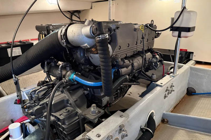  Yacht Photos Pics Engine room of a 2006 Mainship 34 Trawler, showcasing detailed mechanical components.