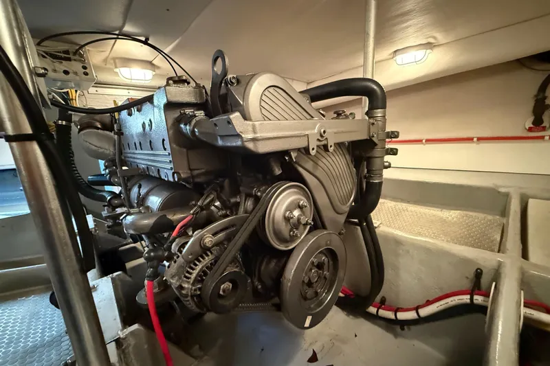  Yacht Photos Pics Engine room of 2006 Mainship 34 Trawler, showcasing detailed mechanical components.