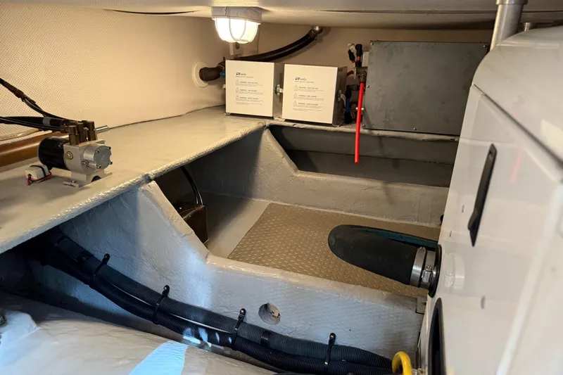  Yacht Photos Pics Engine room of 2006 Mainship 34 Trawler, featuring mechanical components and wiring.