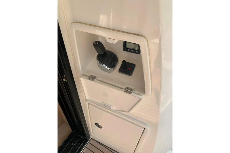 Fly Away Yacht Photos Pics Control panel of a 2018 Prestige 520 yacht, featuring joystick and display.