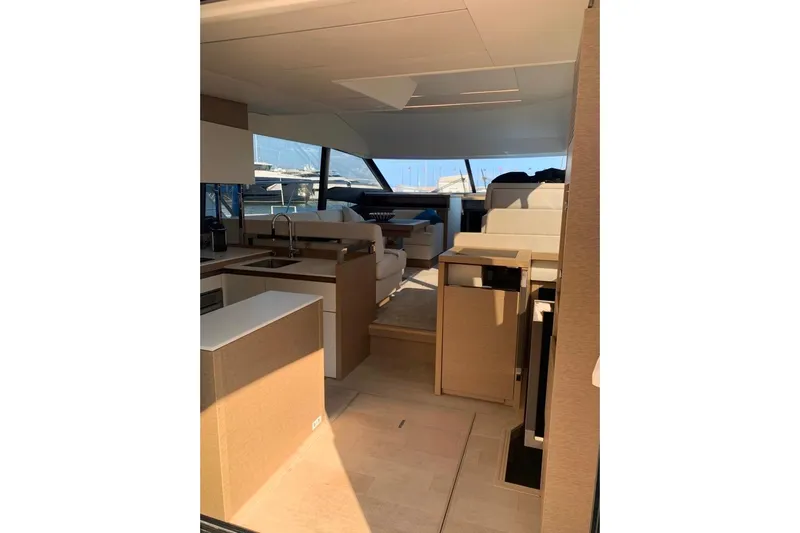 Fly Away Yacht Photos Pics Luxurious interior of a 2018 Prestige 520 yacht with modern furnishings and ample natural light.