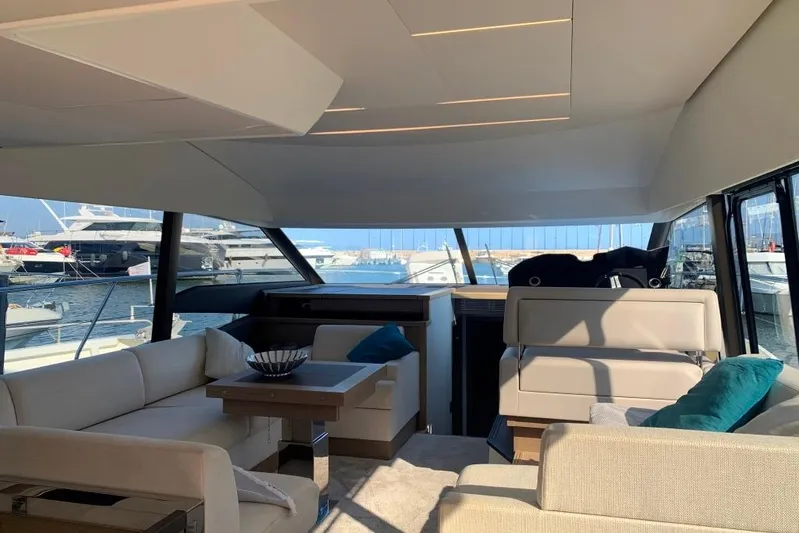 Fly Away Yacht Photos Pics Luxurious interior of a 2018 Prestige 520 yacht with elegant seating and marina view.