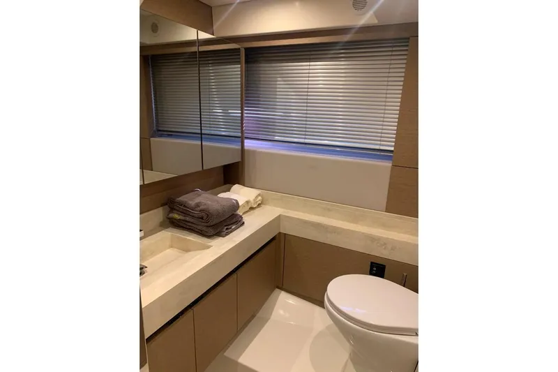 Fly Away Yacht Photos Pics Luxurious bathroom in 2018 Prestige 520 yacht with modern fixtures and elegant design.