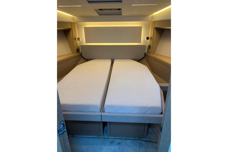 Fly Away Yacht Photos Pics Luxurious cabin interior of 2018 Prestige 520 yacht with twin beds and ambient lighting.