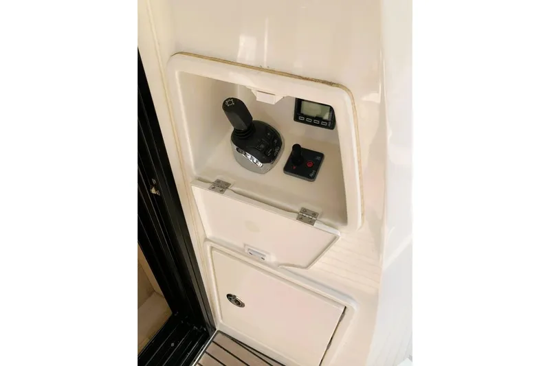 Fly Away Yacht Photos Pics Control panel of a 2018 Prestige 520 yacht, featuring joystick and display.