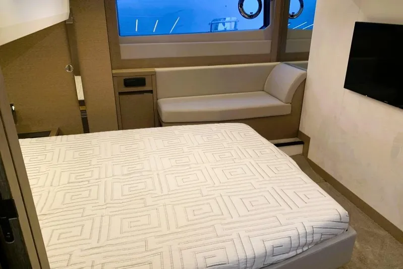 Fly Away Yacht Photos Pics Luxurious 2018 Prestige 520 yacht bedroom with modern decor and large window view.