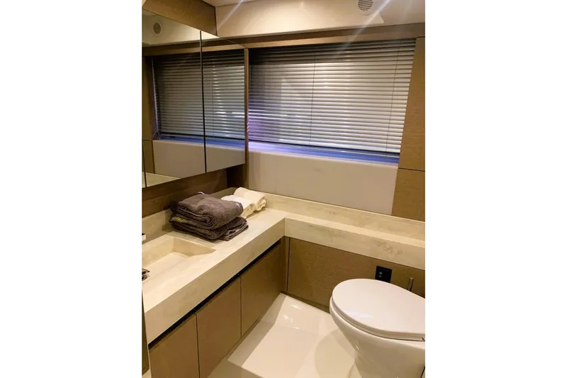 Fly Away Yacht Photos Pics Luxurious bathroom in 2018 Prestige 520 yacht with modern fixtures and elegant design.