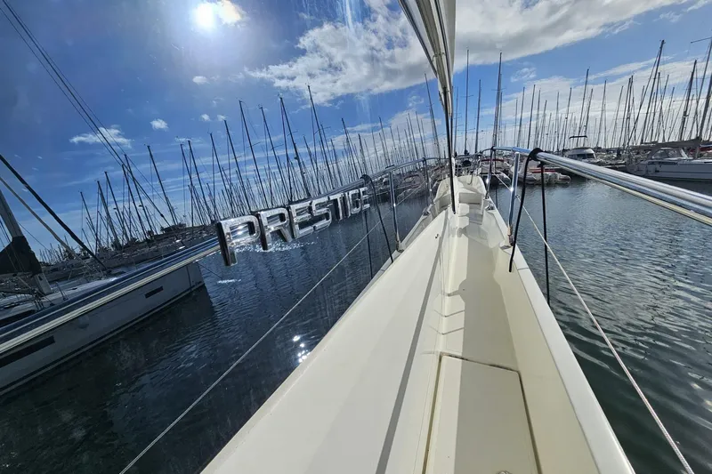 Fly Away Yacht Photos Pics 2018 Prestige 520 yacht reflecting marina view under sunny sky.