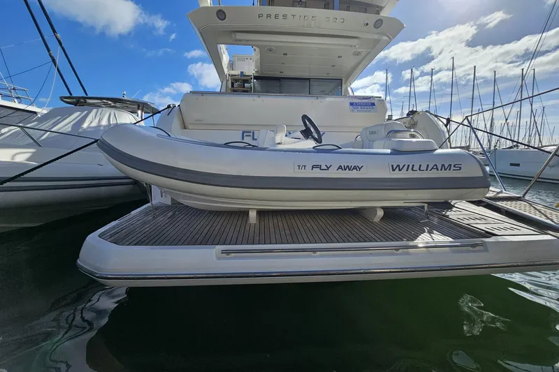 Fly Away Yacht Photos Pics Luxury 2018 Prestige 520 yacht with Williams tender docked at marina.