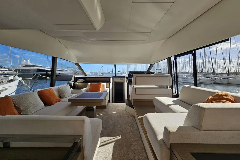 Fly Away Yacht Photos Pics Luxurious interior of a 2018 Prestige 520 yacht with elegant seating and marina view.