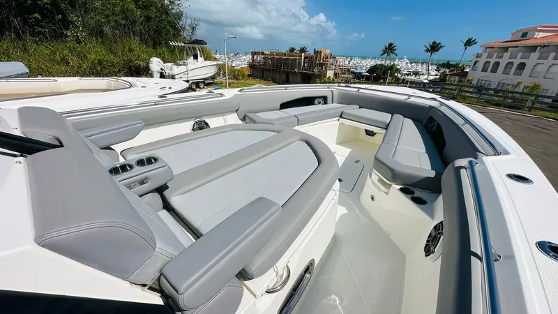  Yacht Photos Pics 2023 Boston Whaler 360 Outrage boat interior with luxurious seating and ocean view.