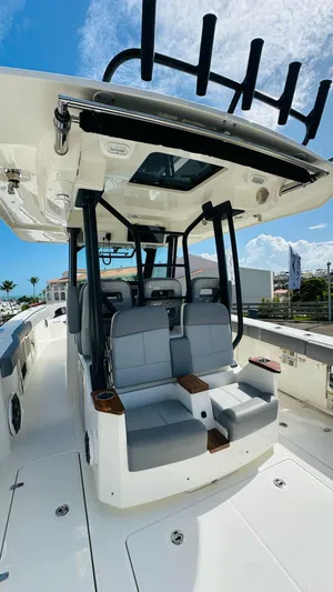  Yacht Photos Pics 2023 Boston Whaler 360 Outrage boat with sleek seating and modern design.