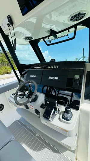  Yacht Photos Pics 2023 Boston Whaler 360 Outrage helm with Simrad electronics and modern controls.