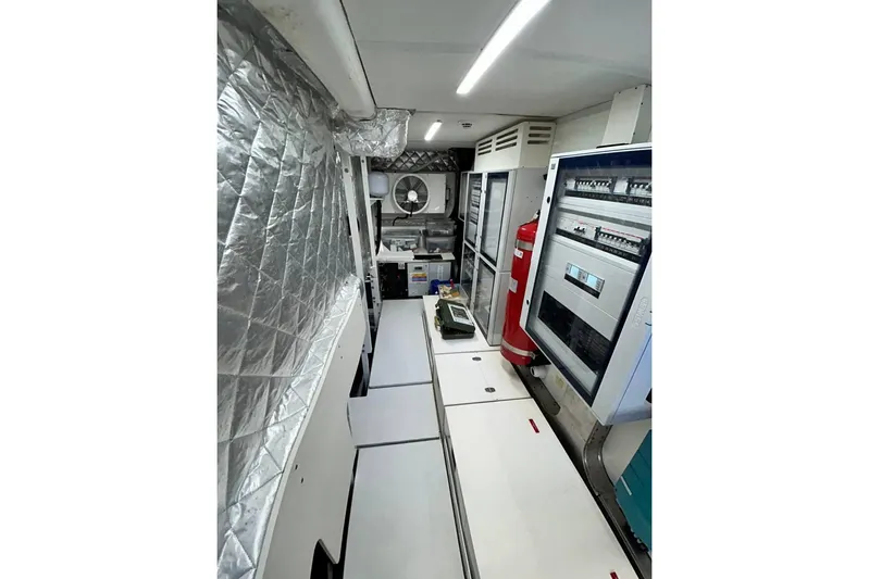  Yacht Photos Pics Engine room of 2023 Cranchi Sessantasette 67 yacht with control panels and equipment.