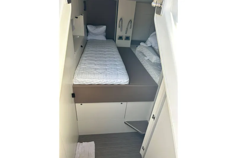  Yacht Photos Pics 2023 Cranchi Sessantasette 67 yacht cabin with twin beds and modern design.