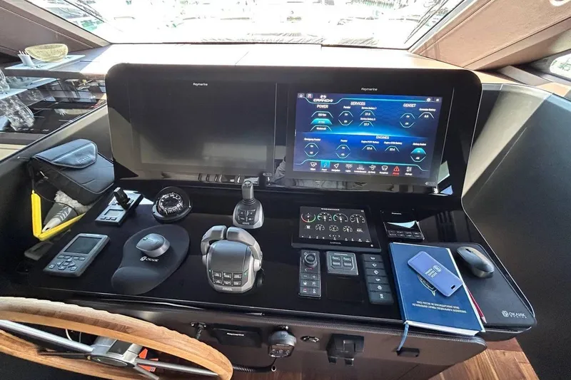  Yacht Photos Pics Control panel of 2023 Cranchi Sessantasette 67 yacht with advanced navigation systems.