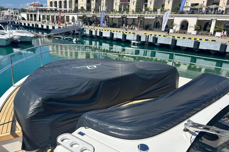  Yacht Photos Pics Luxury yacht Cranchi Sessantasette 67 docked at marina, covered deck, 2023 model.