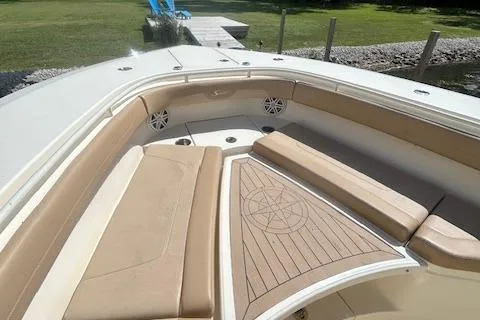 Seas Today Yacht Photos Pics 2019 Scout 355 LXF boat interior with beige seating and wood accents.