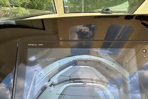 Seas Today Yacht Photos Pics 2019 Scout 355 LXF boat dashboard with GPS display and scenic reflection.