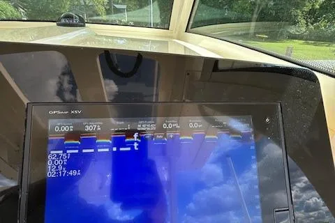 Seas Today Yacht Photos Pics 2019 Scout 355 LXF boat dashboard with GPS display and scenic view.