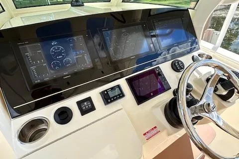 Seas Today Yacht Photos Pics 2019 Scout 355 LXF boat dashboard with advanced navigation and control systems.