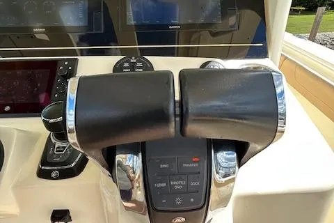 Seas Today Yacht Photos Pics Throttle controls on a 2019 Scout 355 LXF boat dashboard.